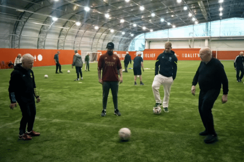 Players passing the ball with Emil Smith-Rowe